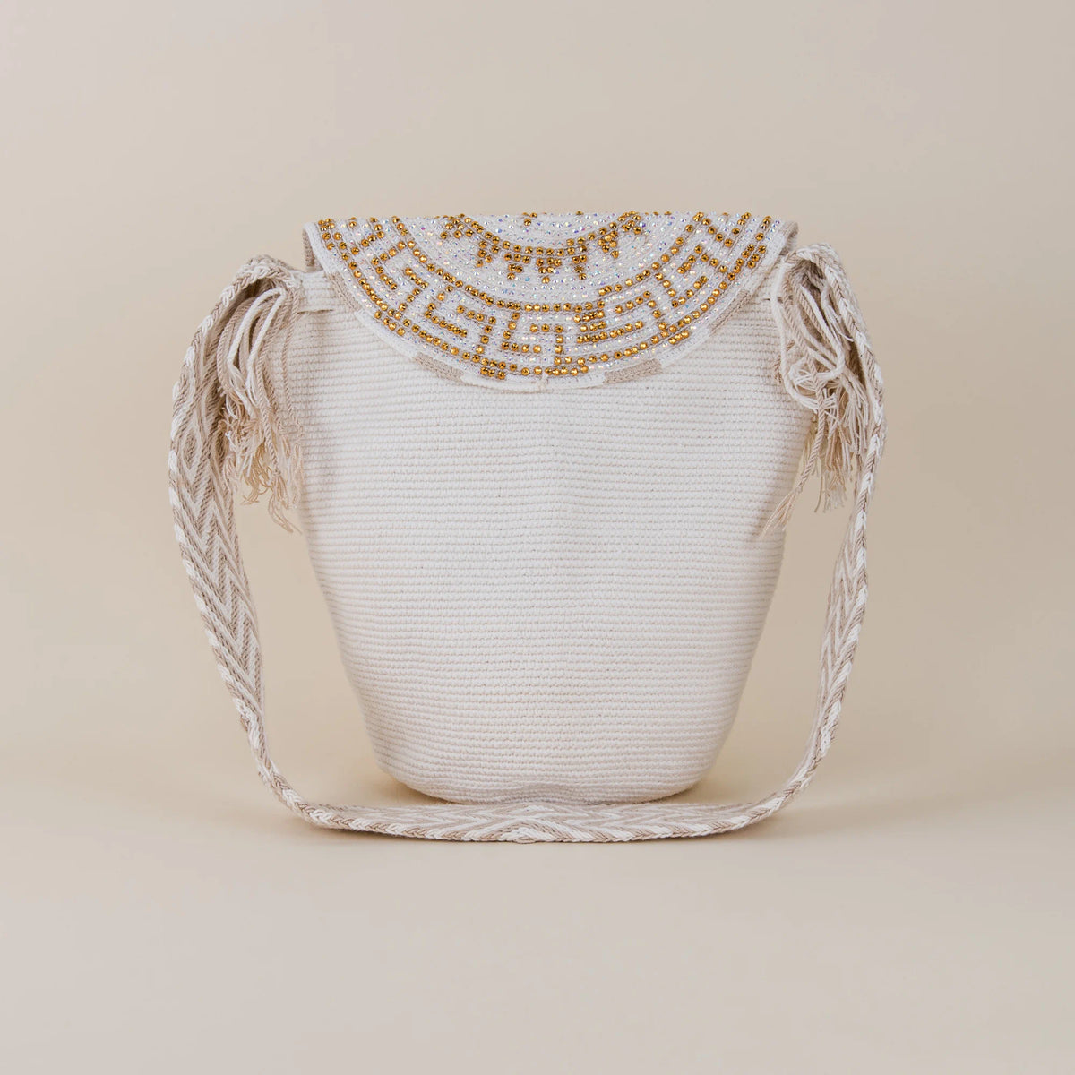 Back view of Fusa Wayuu Mochila with Lid showing white handwoven construction, shoulder strap and embellished lid – Maison Monserrate