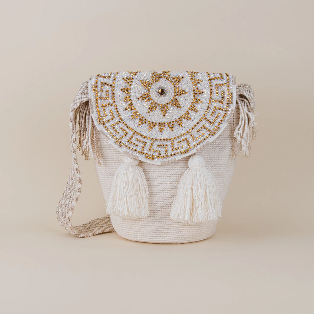Front view of Fusa Wayuu Mochila with Lid featuring white handwoven construction, crystal-embellished lid and matching tassels – Maison Monserrate