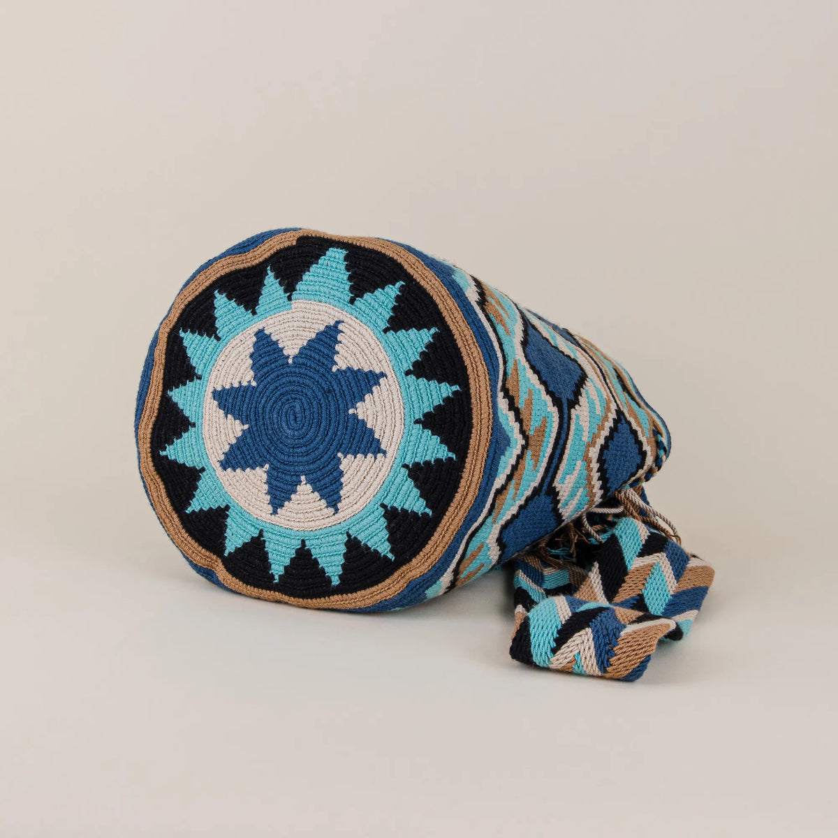 Bottom view of Pasto Wayuu Mochila showing circular geometric handwoven base and matching shoulder strap – Maison Monserrate
