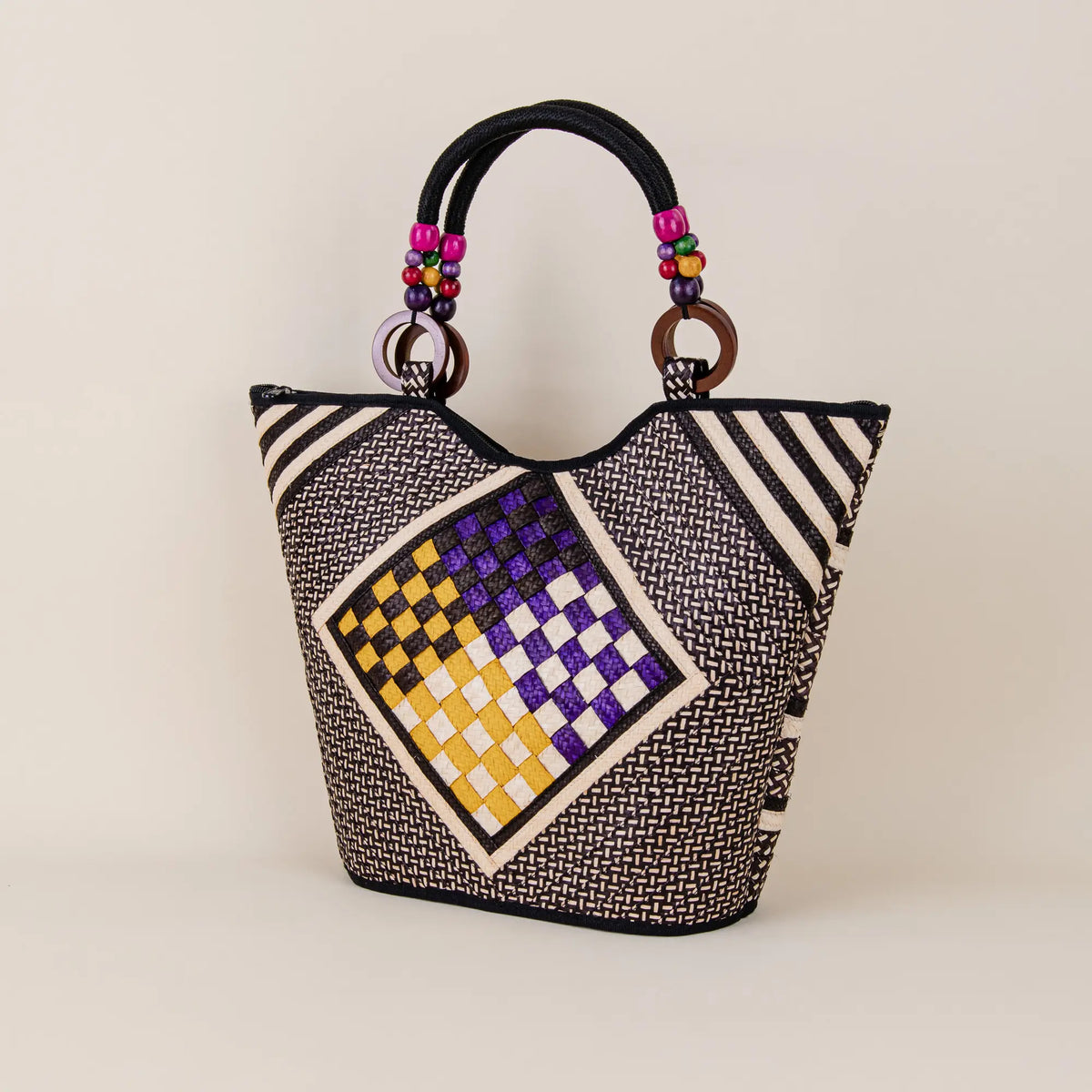 Policarpa handcrafted Arrow Cane Handbag showing geometric weaving and Colombian artisan details – Maison Monserrate