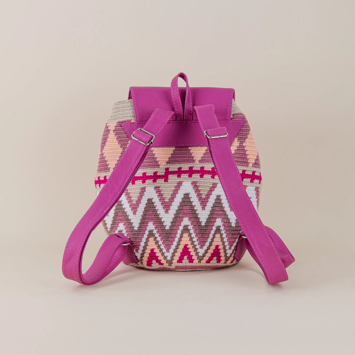Back view of Riohacha Wayuu Backpack with pink and cream handwoven pattern and adjustable fuchsia shoulder straps – Maison Monserrate