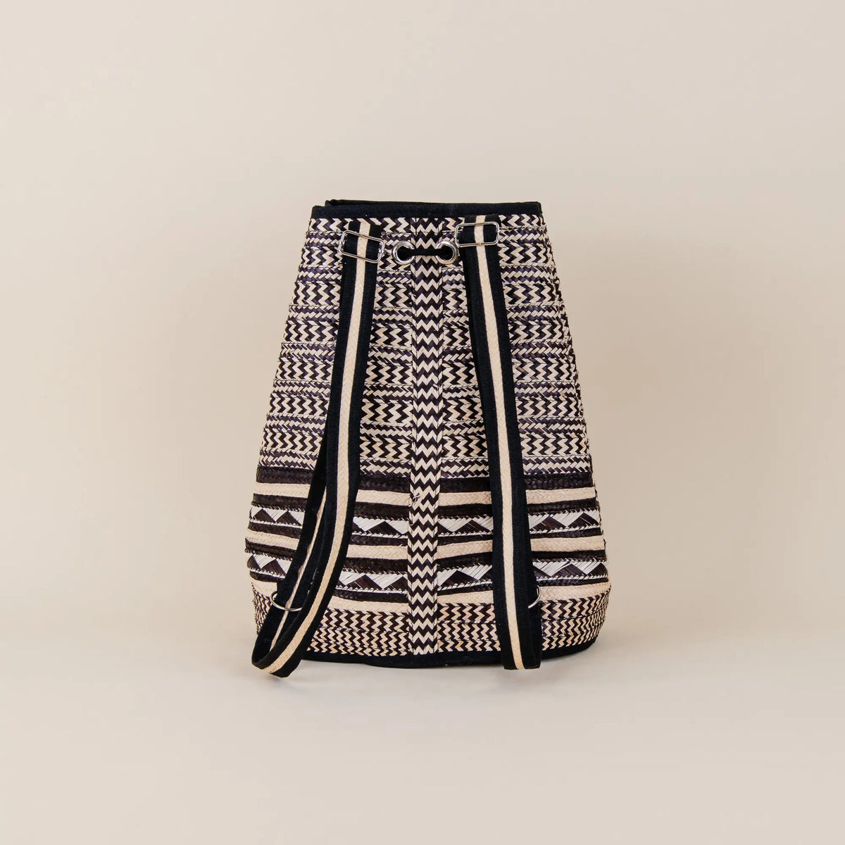 Back view of Santa Cruz Arrow Cane Backpack showing traditional Colombian handwoven craftsmanship and shoulder straps – Maison Monserrate