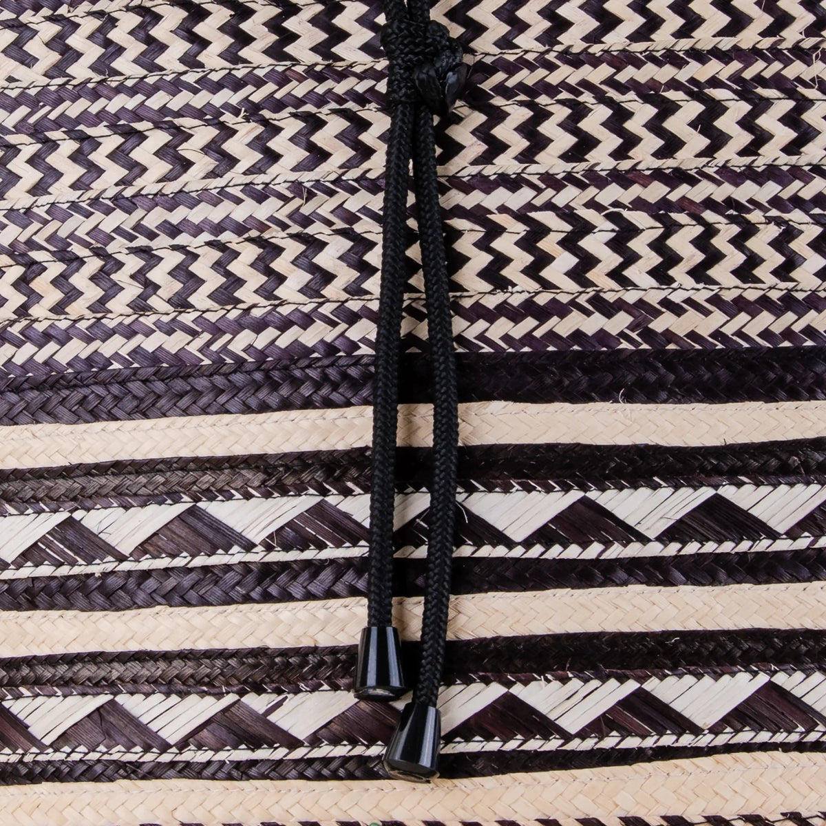 Close-up of Santa Cruz Arrow Cane Backpack showing detailed handwoven arrow cane pattern and artisan craftsmanship – Maison Monserrate