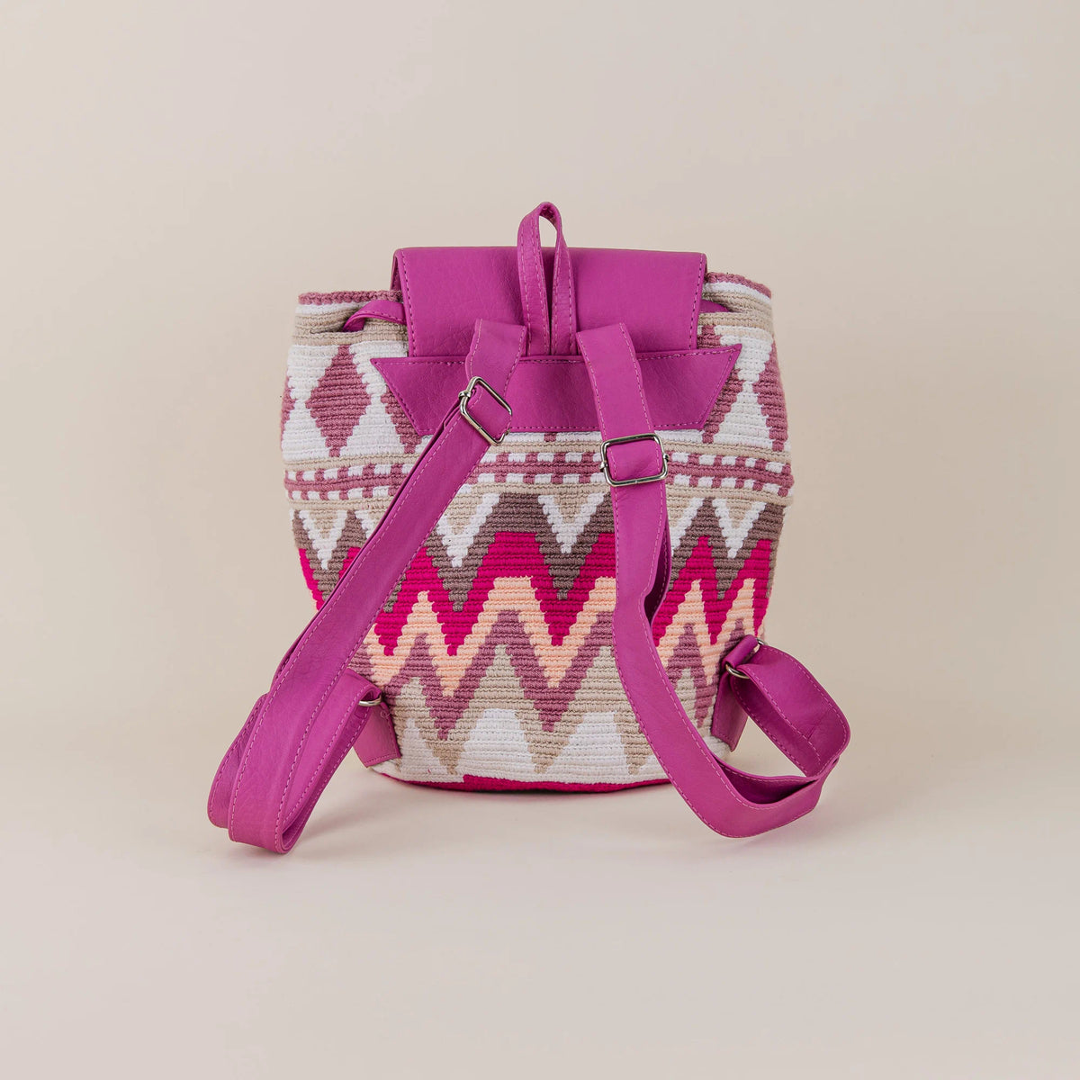 Back view of Mompox Wayuu Backpack showing colorful handwoven geometric pattern and adjustable fuchsia shoulder straps – Maison Monserrate