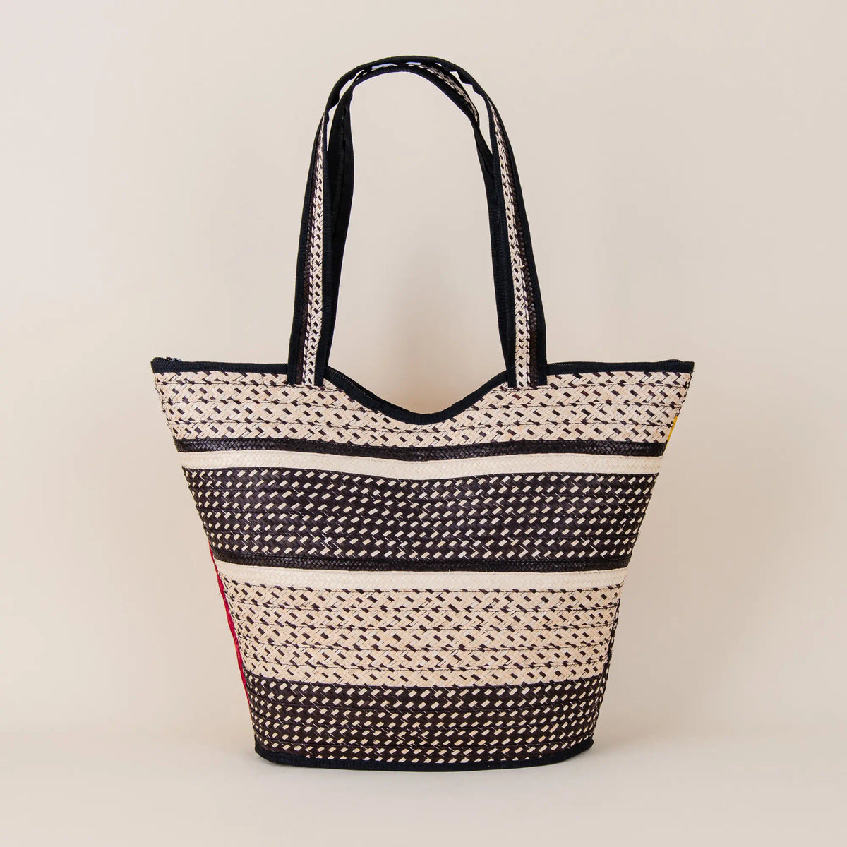 Back view of Mosquera Arrow Cane Handbag showing traditional Colombian handwoven arrow cane craftsmanship – Maison Monserrate