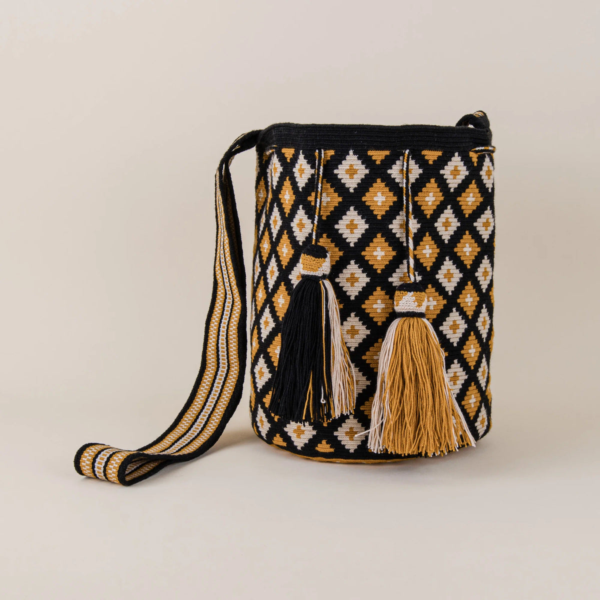Sabanagrande Wayuu Bag handwoven in black, mustard and cream with matching tassels and woven shoulder strap – Maison Monserrate