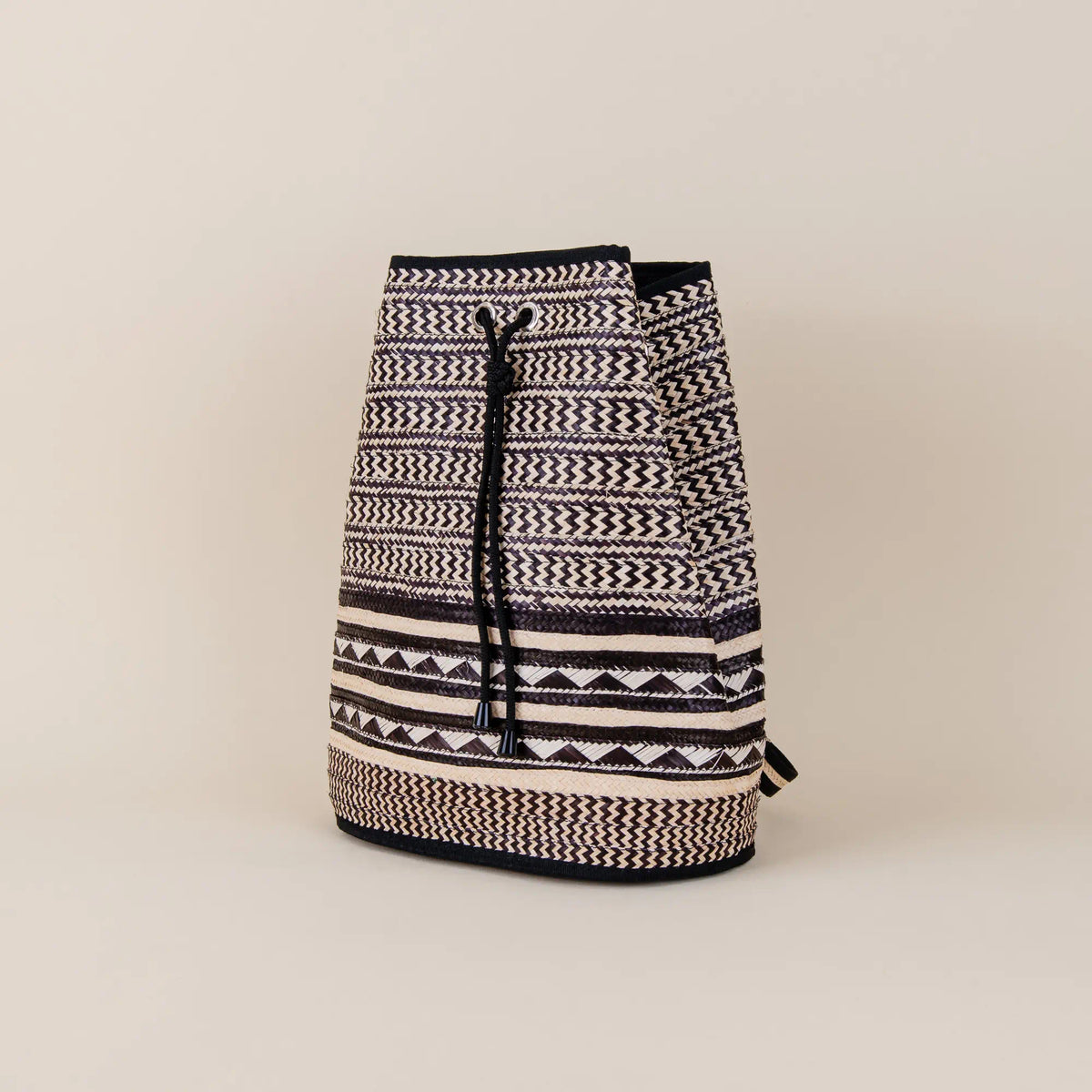 Santa Cruz handcrafted Arrow Cane Backpack showing geometric weaving and Colombian artisan details – Maison Monserrate