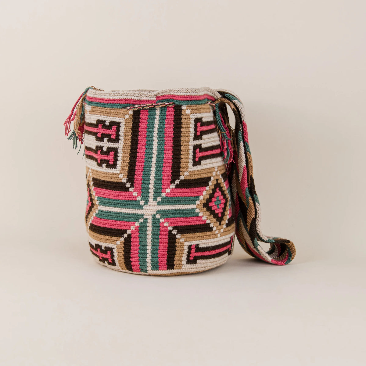 Back view of Viani Wayuu Bag showing pink, green, brown and cream handwoven geometric patterns – Maison Monserrate